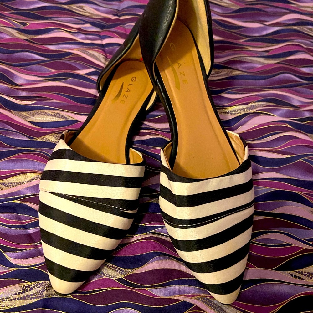 Black and white striped pointed toe flats.